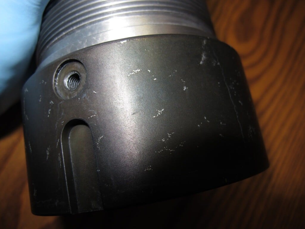 Detailed view of a metal piece featuring a hole, relevant to Cleaning Blind Holes in Rockaway